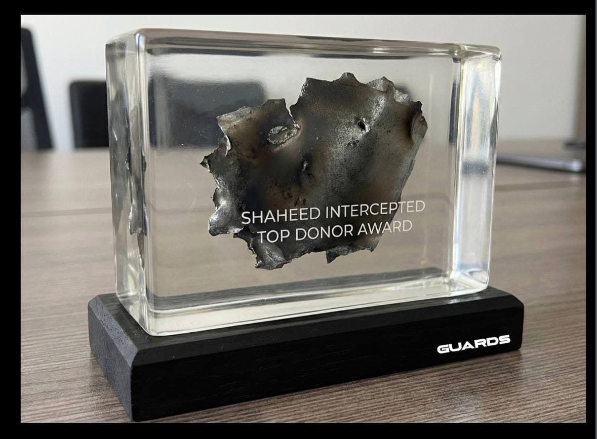 GUARDS top team award containing an intercepted Shahed fragment